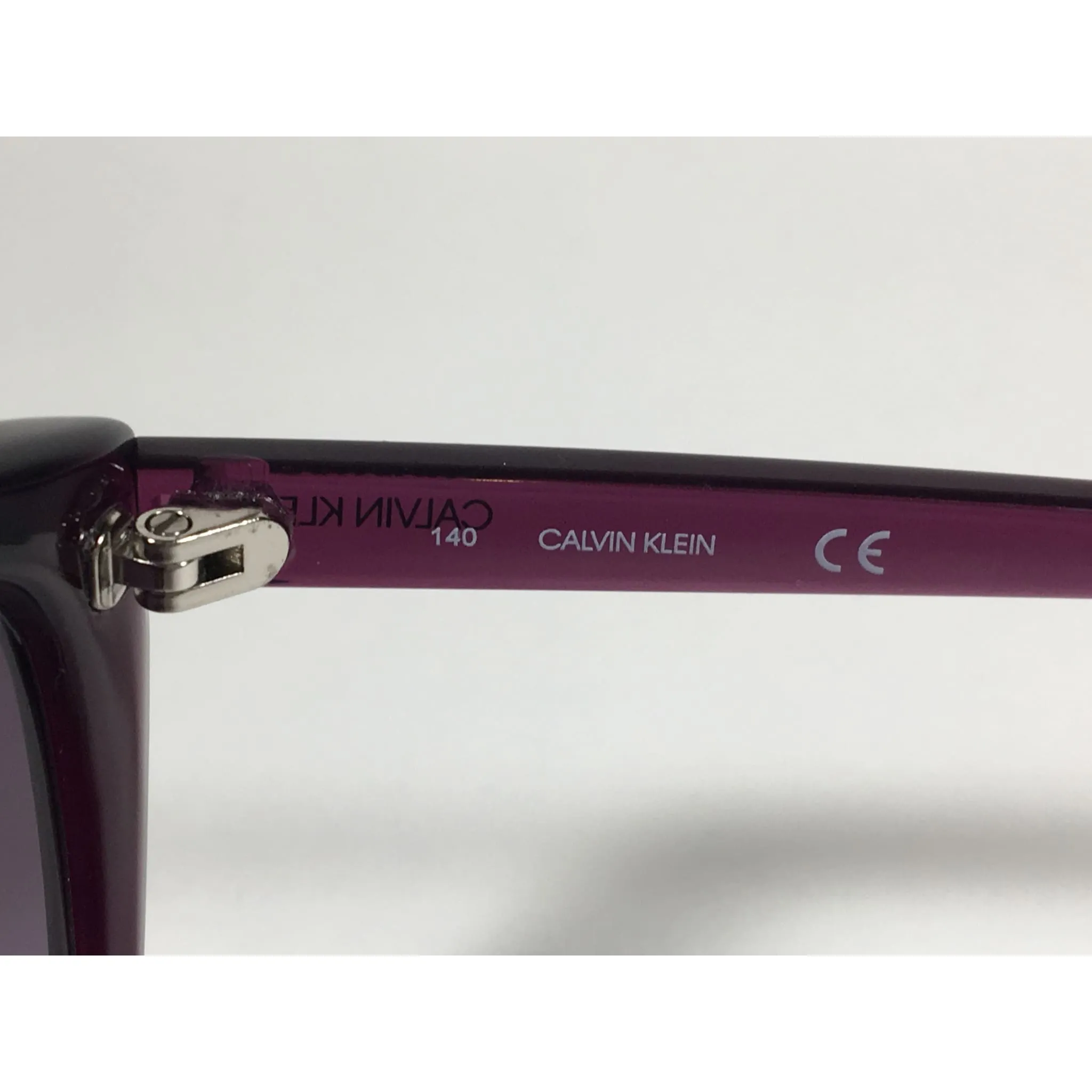 Calvin Klein CK19543S 500  Cat Eye Sunglasses Purple Frame Smoke Gradient Lens