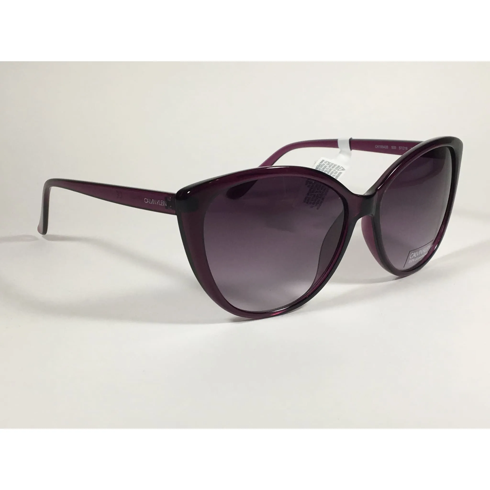 Calvin Klein CK19543S 500  Cat Eye Sunglasses Purple Frame Smoke Gradient Lens