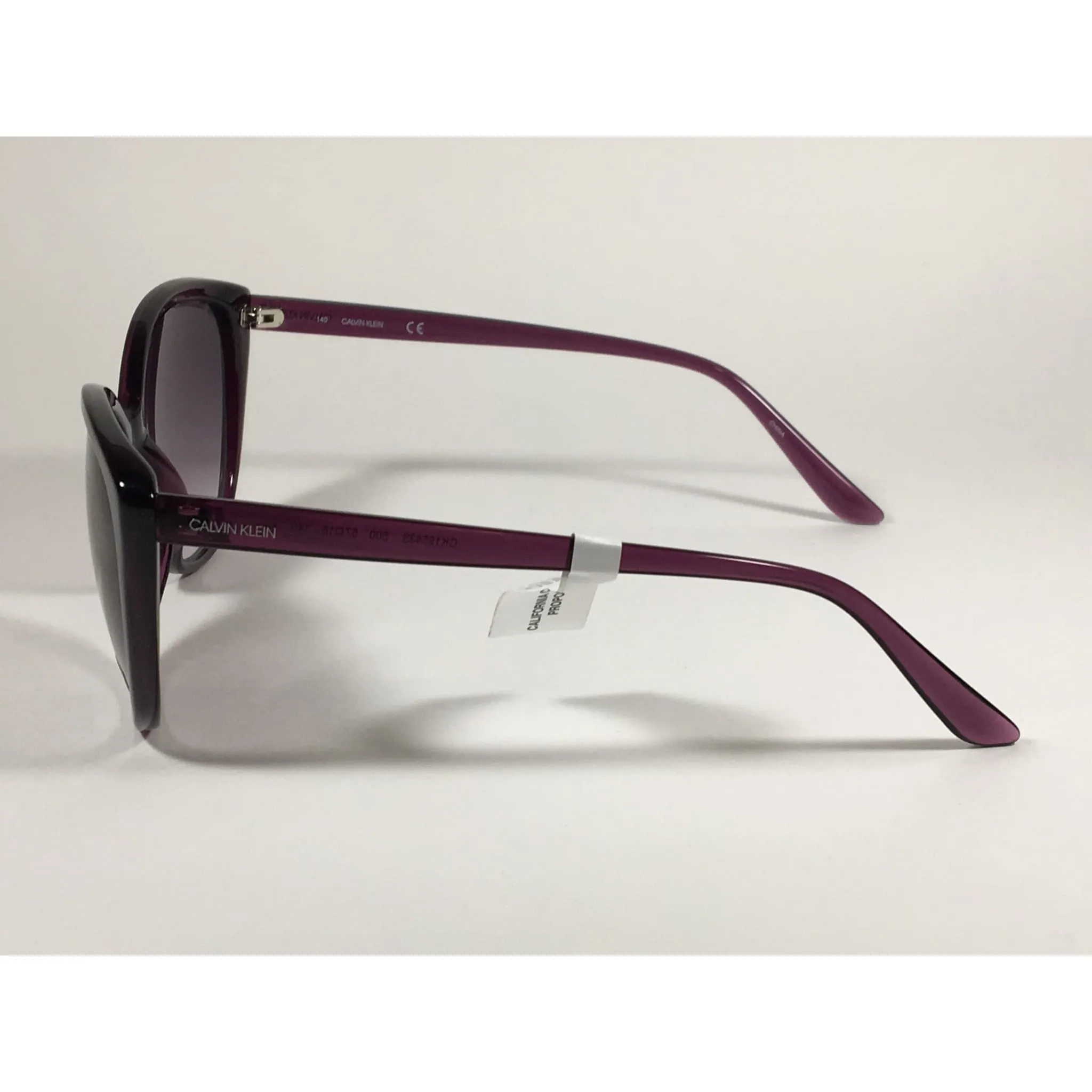 Calvin Klein CK19543S 500  Cat Eye Sunglasses Purple Frame Smoke Gradient Lens