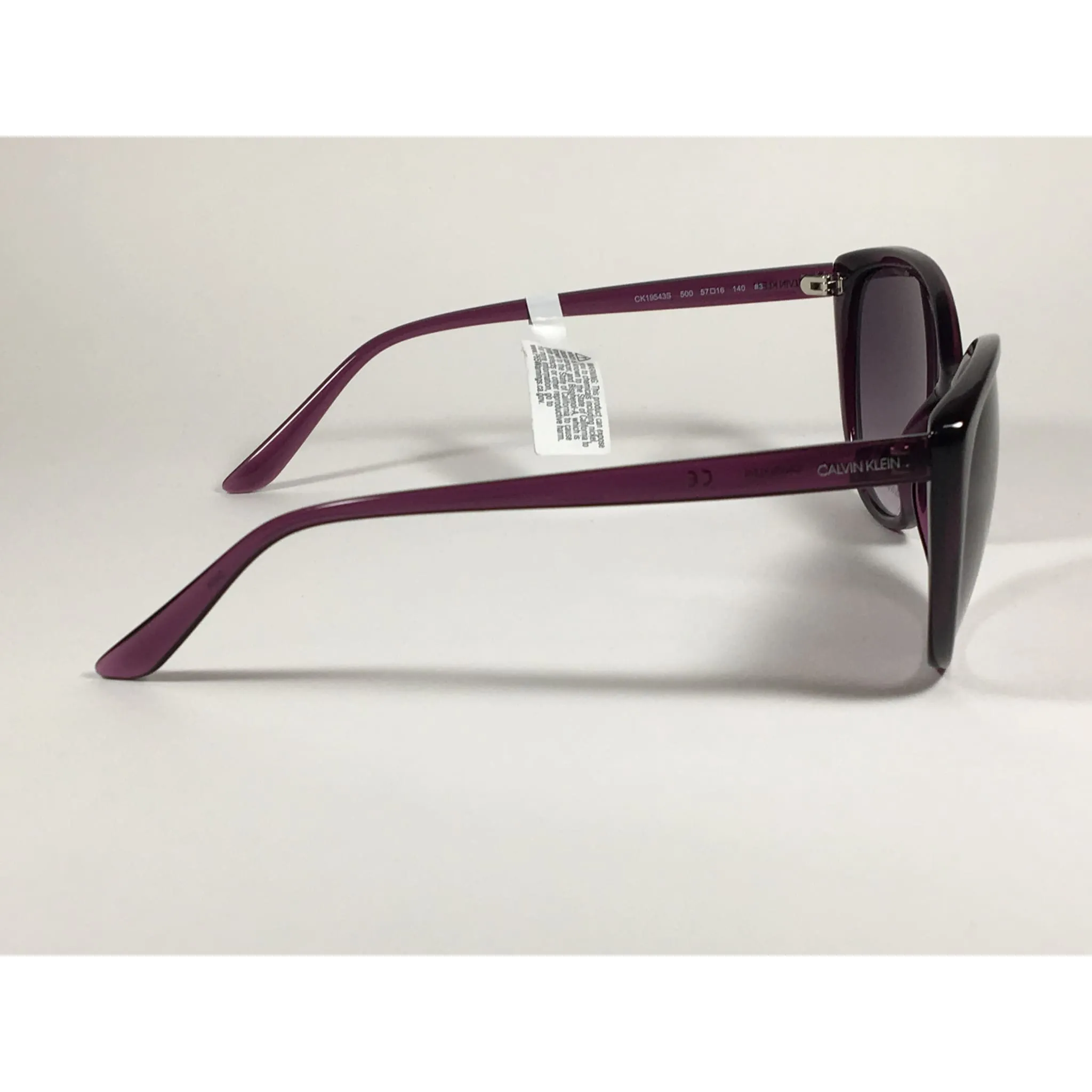 Calvin Klein CK19543S 500  Cat Eye Sunglasses Purple Frame Smoke Gradient Lens