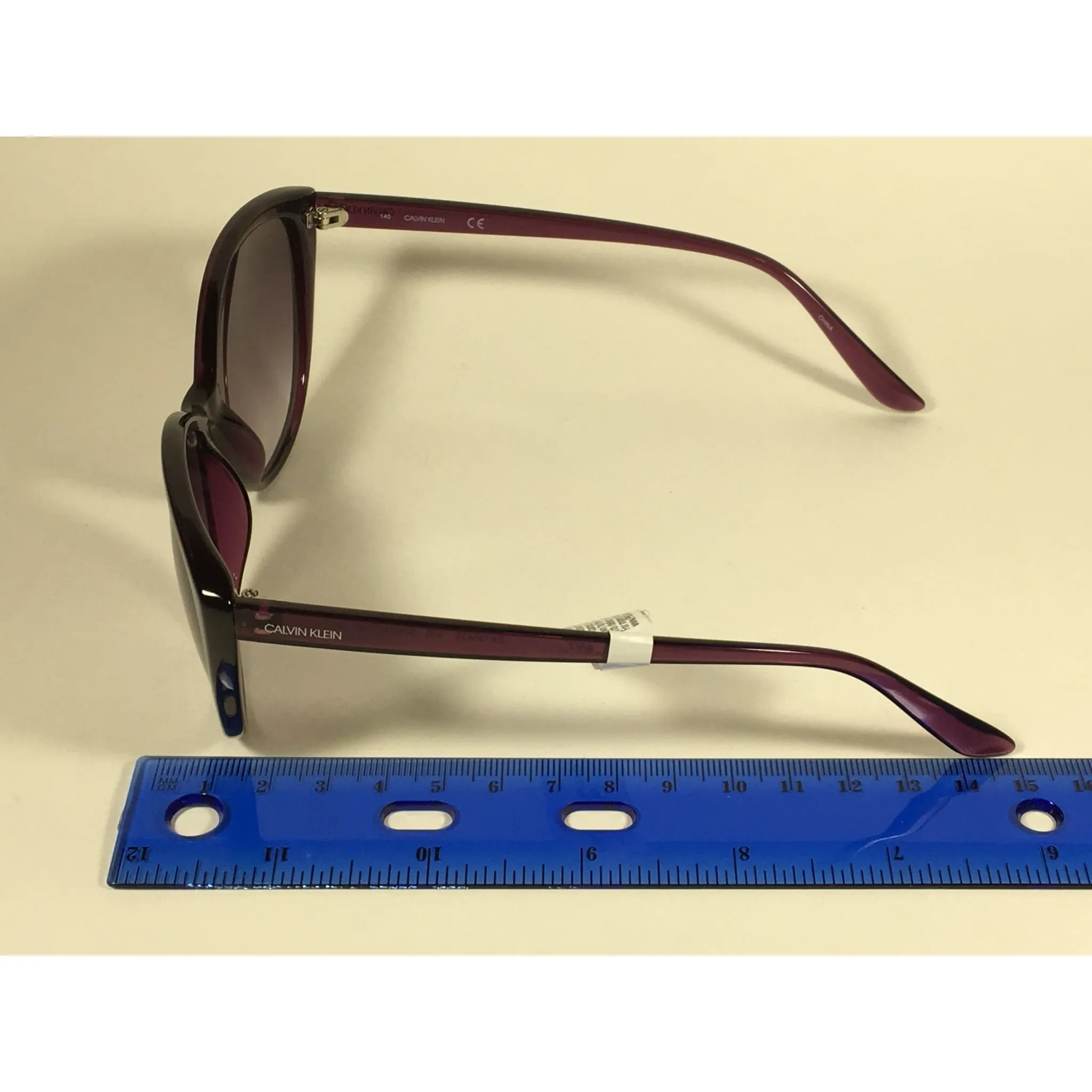 Calvin Klein CK19543S 500  Cat Eye Sunglasses Purple Frame Smoke Gradient Lens