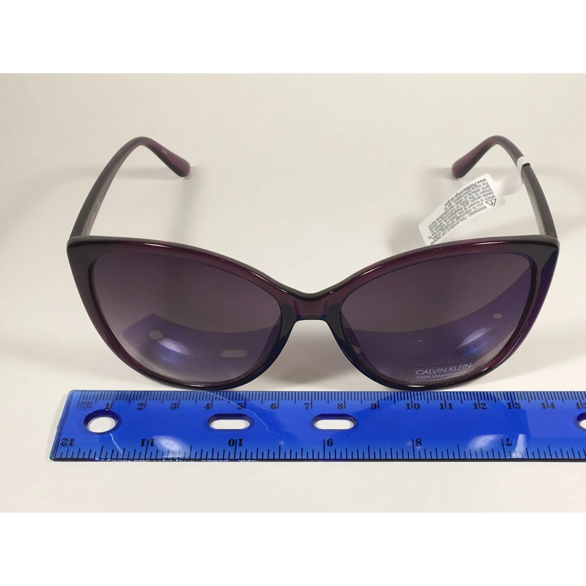 Calvin Klein CK19543S 500  Cat Eye Sunglasses Purple Frame Smoke Gradient Lens