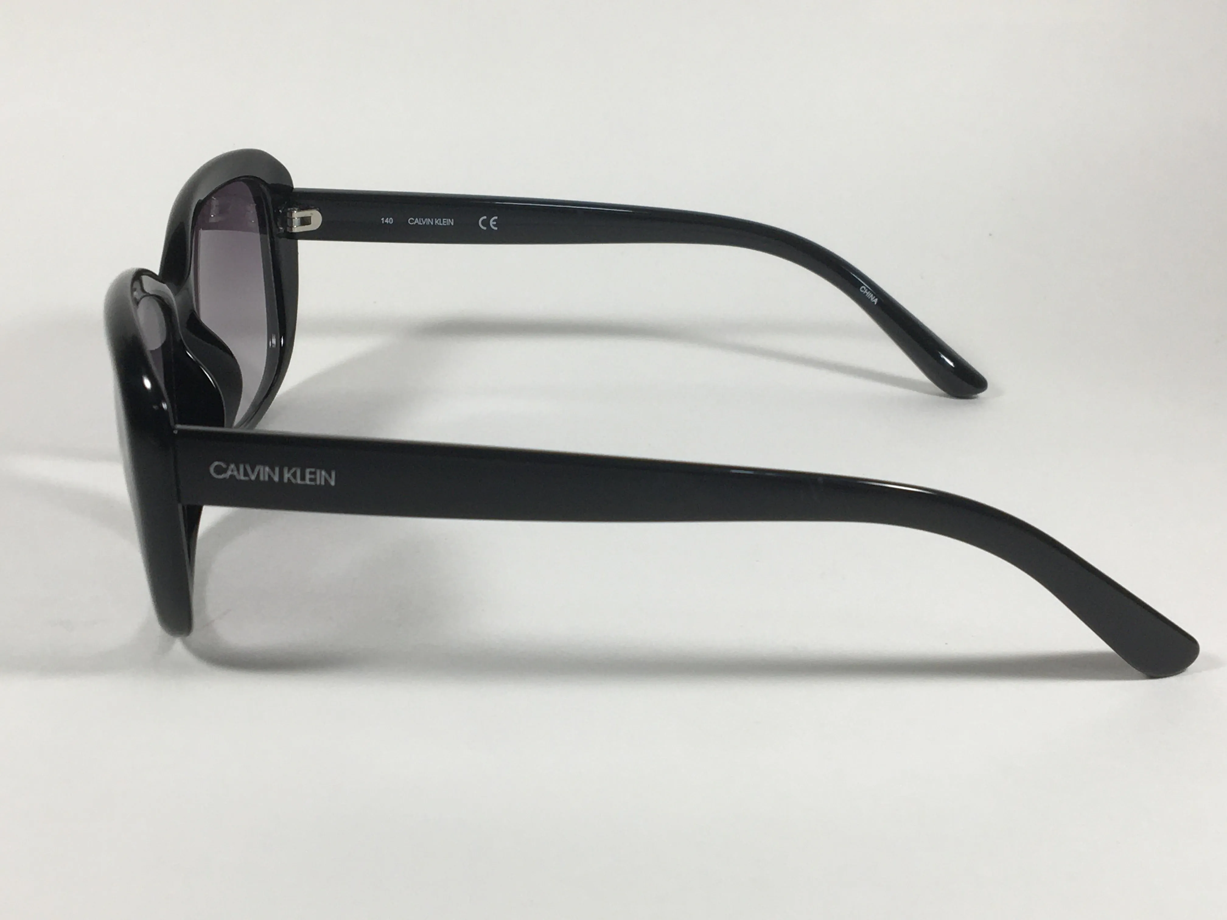 Calvin Klein Oval Sunglasses CK19541S 001 Black Gloss Frame Gray Smoke Gradient Lens
