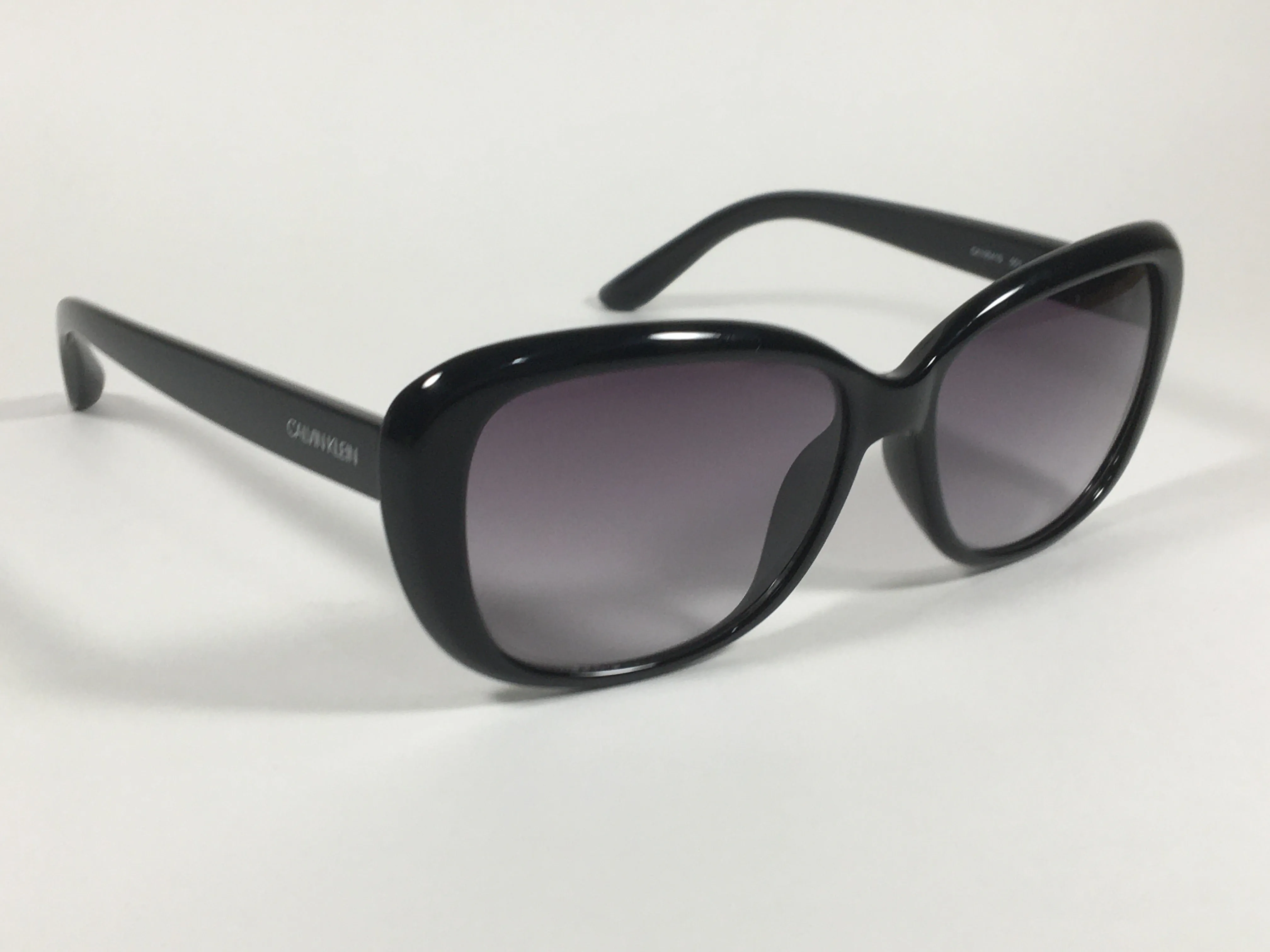 Calvin Klein Oval Sunglasses CK19541S 001 Black Gloss Frame Gray Smoke Gradient Lens