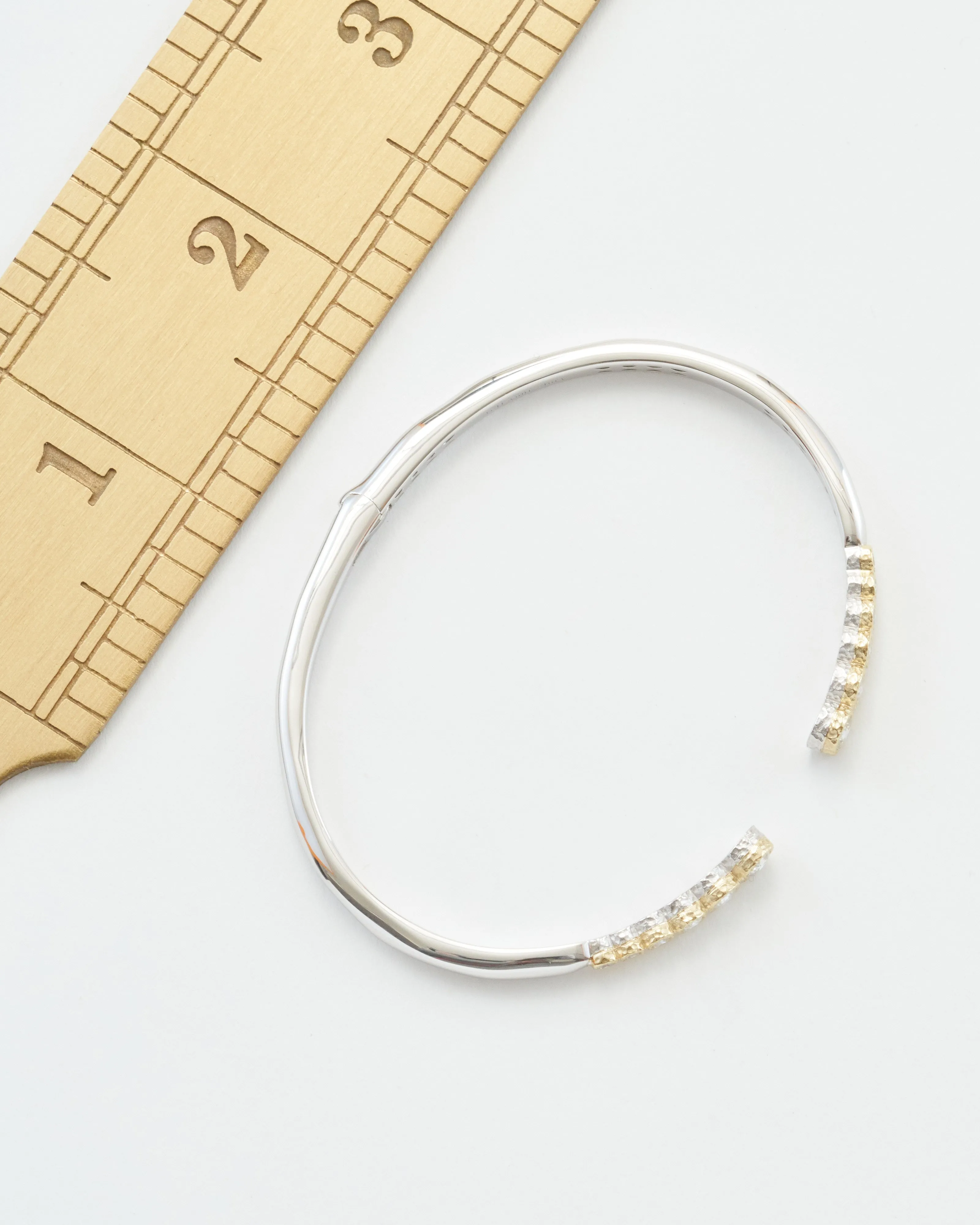 classic two-toned open bezel set diamond bangle