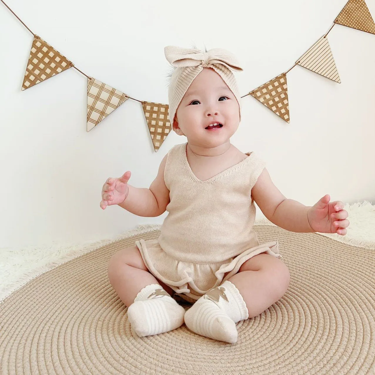 Organic Knitted Sweater: Baby Girl Cable Knit Ruffler Onesie